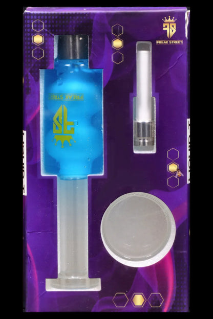 Purple packaging for “Freak Street” cannabis accessories, featuring a glass oil rig, quartz banger, and glass dab tool. 