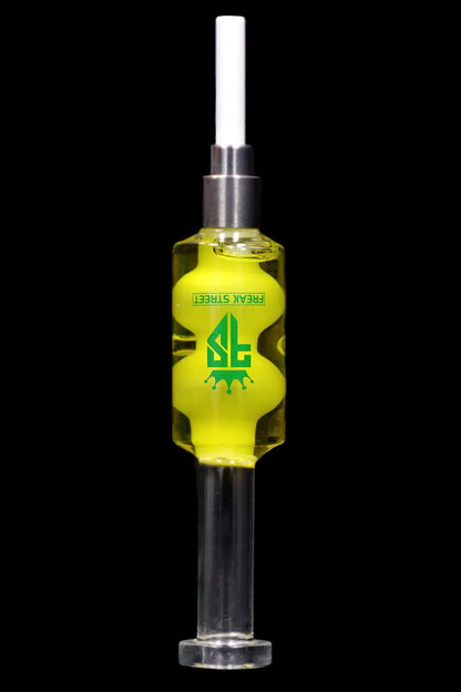 A glass oil rig with a green liquid inside, branded with “Freak Street” in green and black.