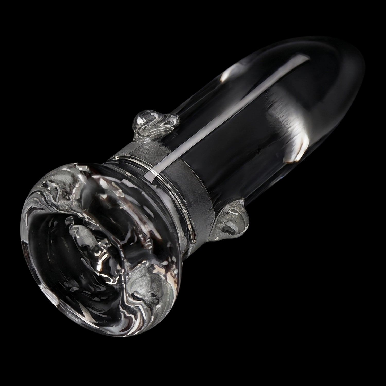 Angled close-up of the Smoke Cartel Glass Nail 18mm showing its clear glass shaft, rounded tip, and textured flared base against a black background