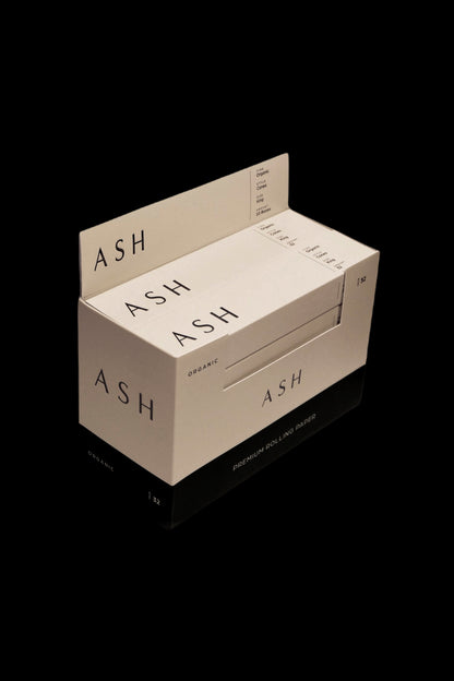 Stacked boxes of “ASH Organic” premium rolling papers on a white background.