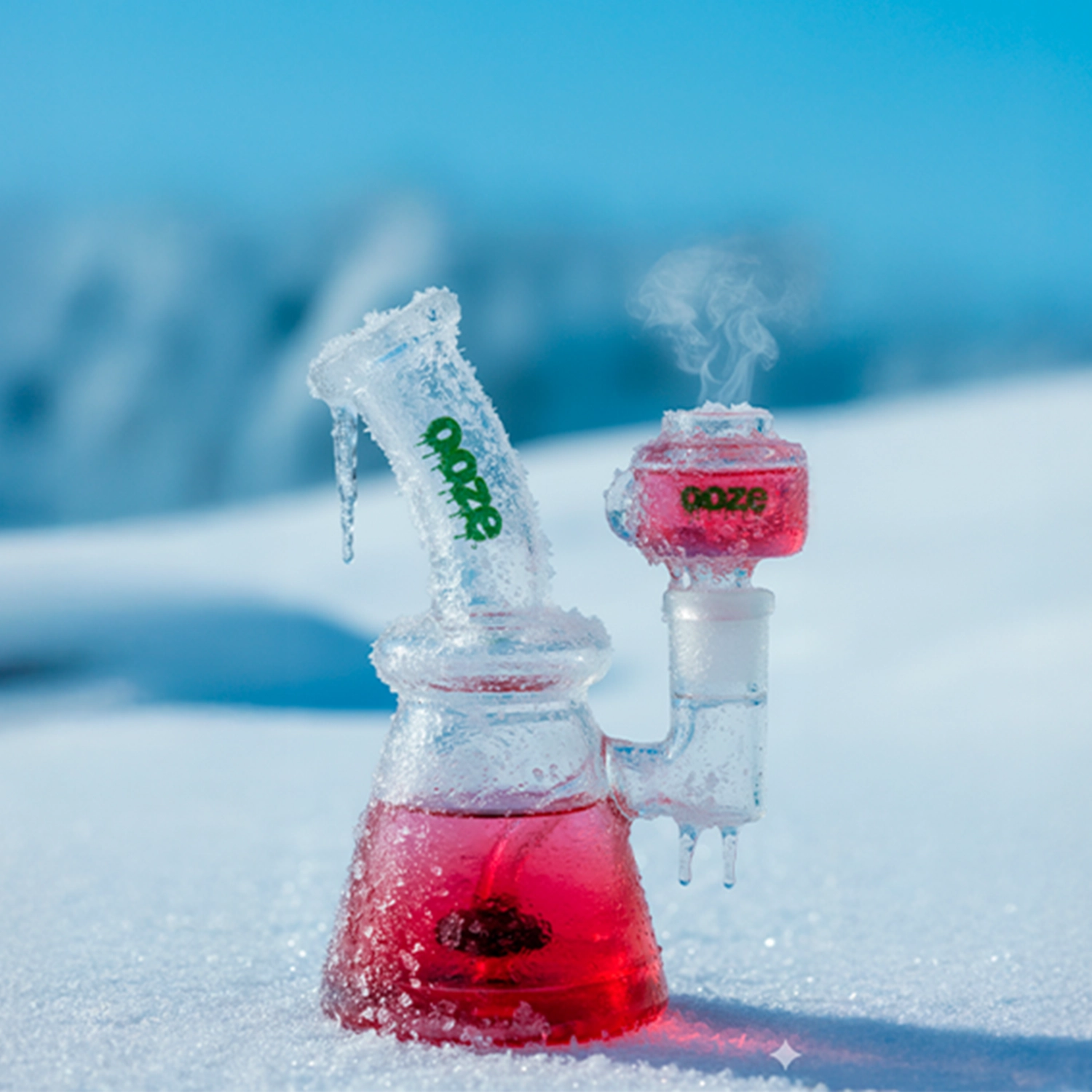 Close-up side view of the Ultra Purple Ooze Glyco Glycerin Chilled Bong sitting in snow with frosted glass, icicles, and pale blue sky background