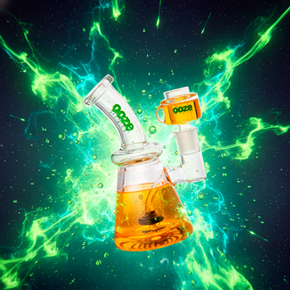 Angled close-up of the Juicy Orange Ooze Glyco Glycerin Chilled Bong against a neon green and teal energy burst background