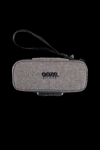 Gray Ooze cannabis accessory case with a black wrist strap, displaying the brand name.