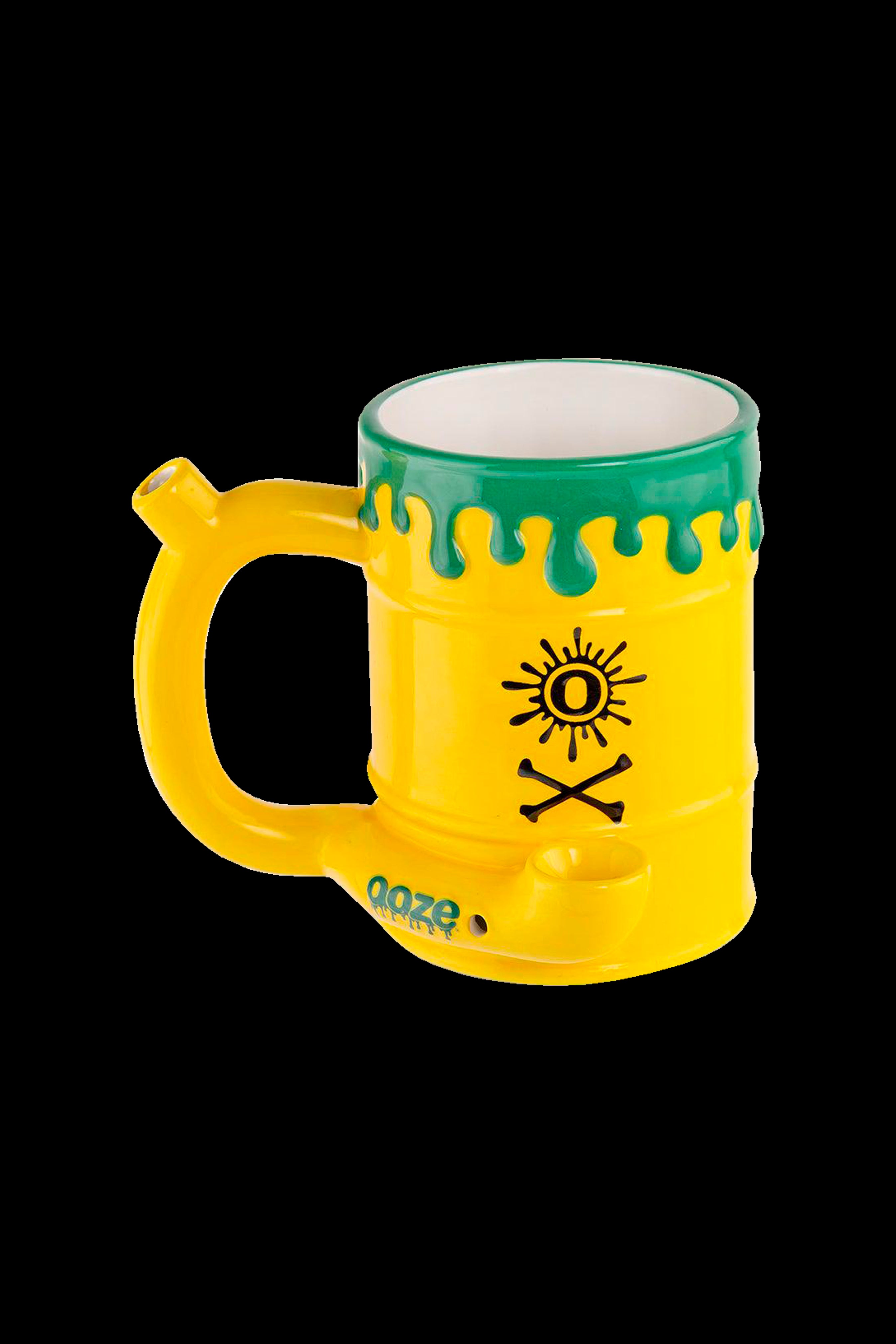 Yellow glass water pipe with green dripping glaze and skull & crossbones design.