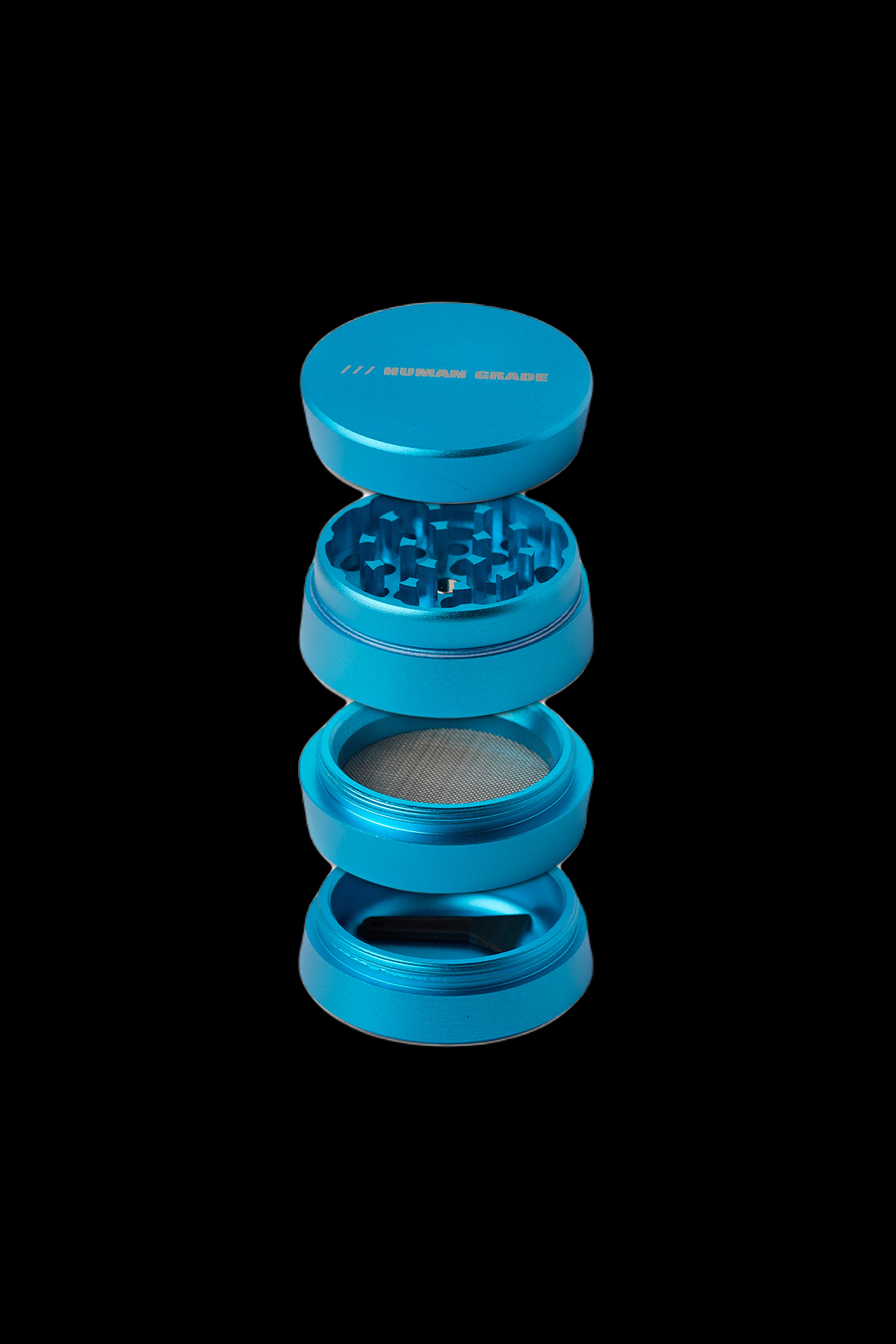 Blue four-piece cannabis grinder against a black background.