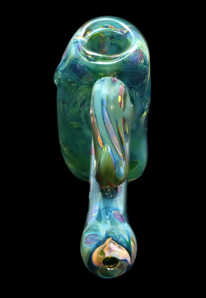 Top-down view of the iridescent Smoke Cartel Gold Fume Bubble Trap Hammer Bubbler - 6 in. showing swirling blue-green glass and a rounded mouthpiece against a black background