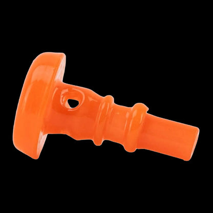 Close-up diagonal view of the bright orange Empire Glassworks PuffCo Peak Pro 3D XL Chamber Glass Joystick Cap against a black background