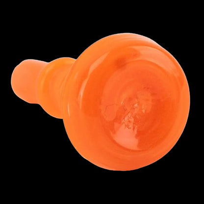 Close-up angled view of the bright orange Empire Glassworks PuffCo Peak Pro 3D XL Chamber Glass Joystick Cap against black.