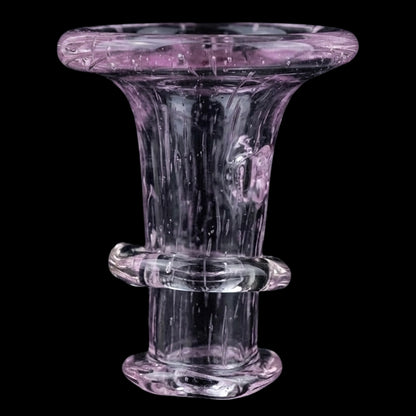 Close-up front view of the Empire Glassworks PuffCo 'New Peak' & Proxy Glass Joystick Cap - Pink Slyme showing translucent pink glass contours and ringed midsection against black.