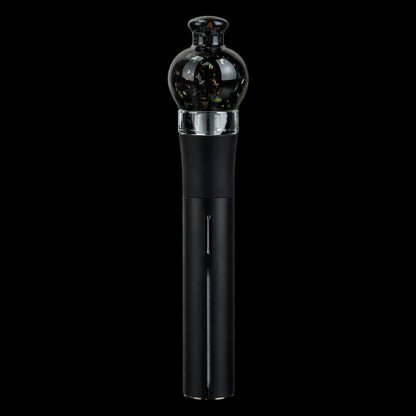Centered vertical close-up of the Empire Glassworks Puffco Pivot Glass Mouthpiece - Black Nebula showing its rounded black glass tip with iridescent flecks.