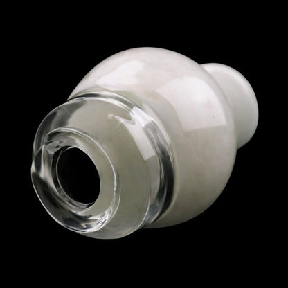 Close-up angled view of the Empire Glassworks Puffco Pivot Glass Mouthpiece - Glow in the Dark showing its rounded, translucent glow surface and polished clear glass rim against a black background