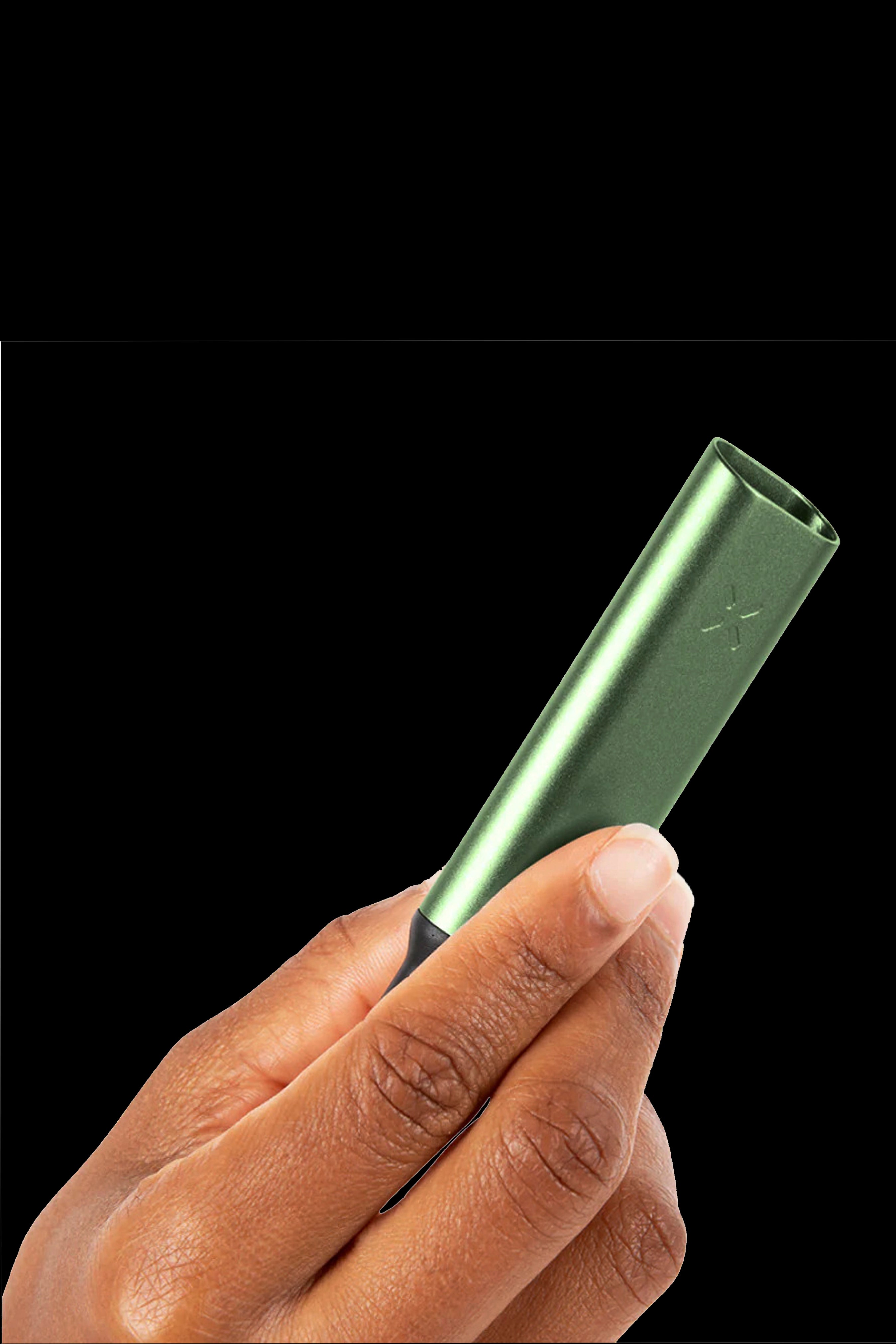 A hand holding a sleek, metallic green cannabis vaporizer pen against a black background.