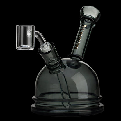 Angled close-up of the Green Flower Phoenix Star 6 Inch Translucent Dome Dab Rig showing its smoky translucent dome, slanted neck, and clear glass joint against a black background