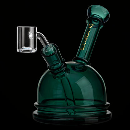 Angled close-up of the dark green Green Flower Phoenix Star 6 Inch Translucent Dome Dab Rig showing its dome top and glass joint.