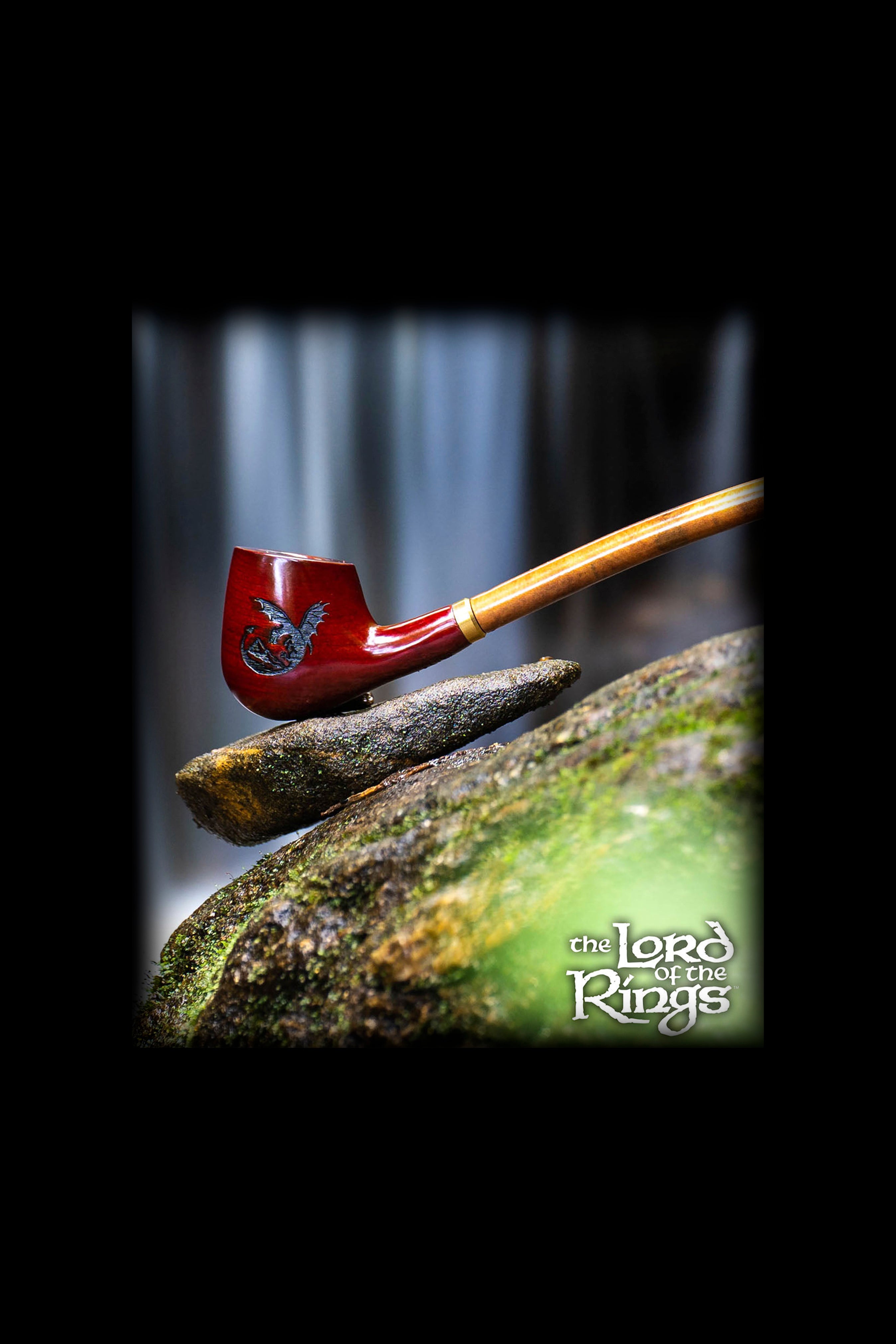 A cannabis pipe rests on moss-covered stone with a "Lord of the Rings" logo at the bottom.