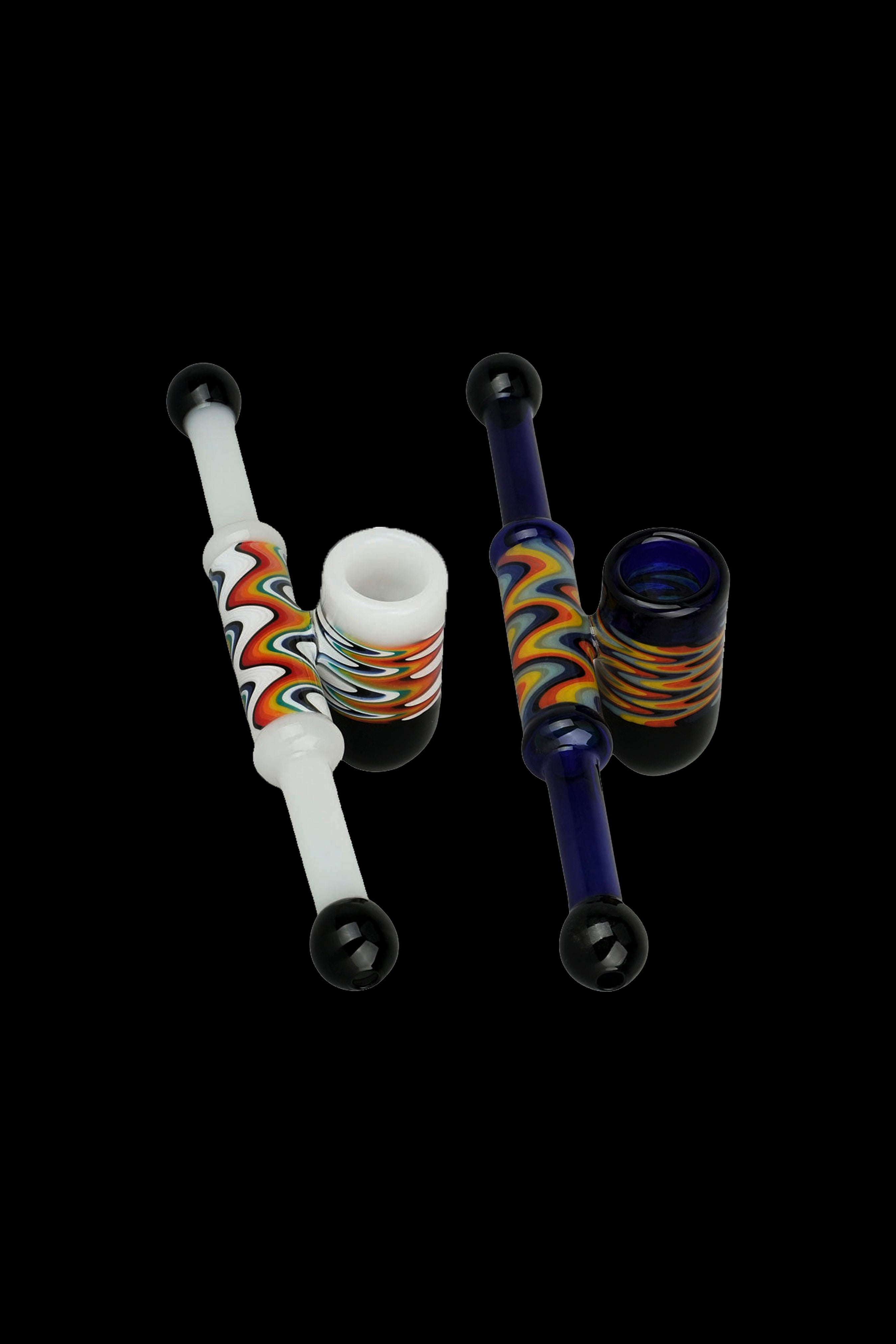 Glass pipes with colorful swirl patterns against a black background.