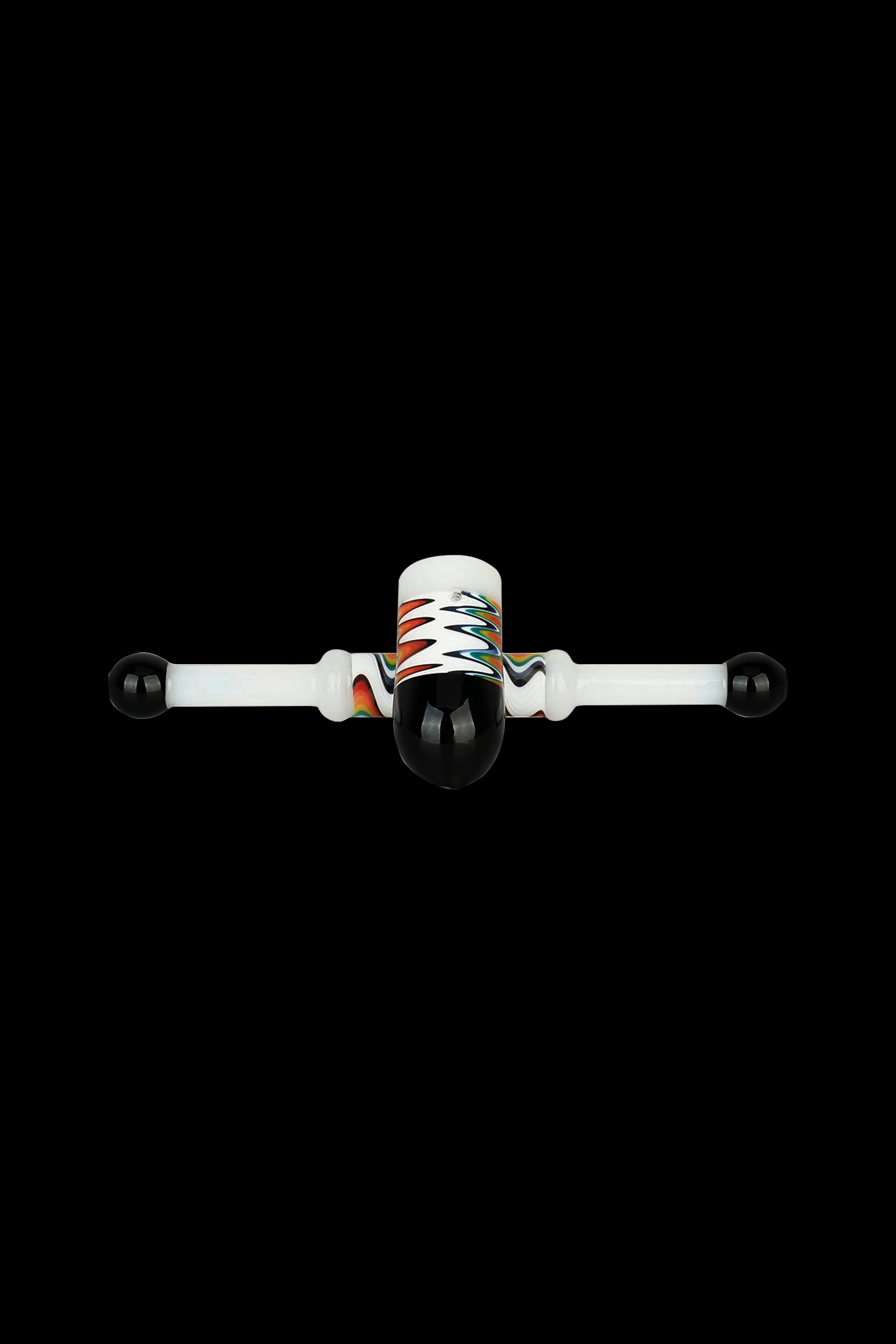 Glass cannabis oil rig with colorful accents on a black background.