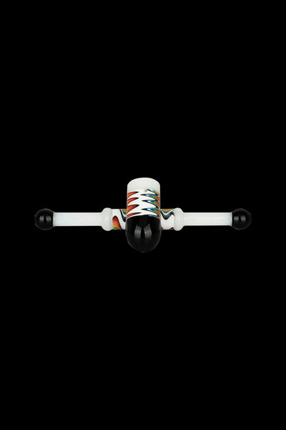 Glass cannabis oil rig with colorful accents on a black background.