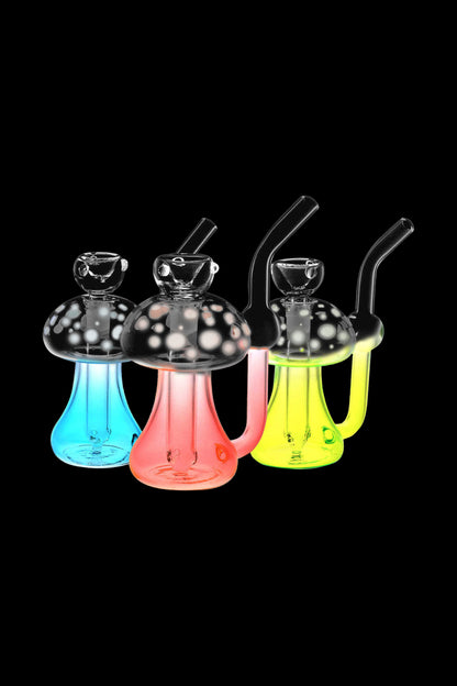 Colorful glass mushroom-shaped dab rigs with water pipes, isolated on a black background.