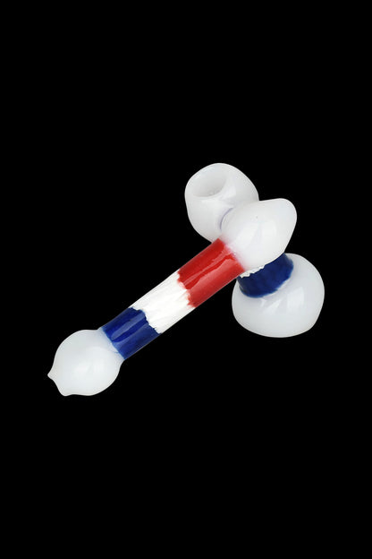 Glass pipe with red, white, and blue accents on a black background.
