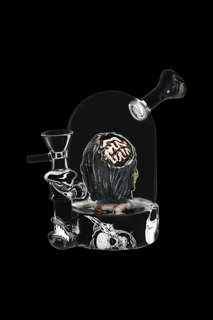 Glass cannabis water pipe shaped like a skull encased in a dome, with intricate details and a dark, moody aesthetic.