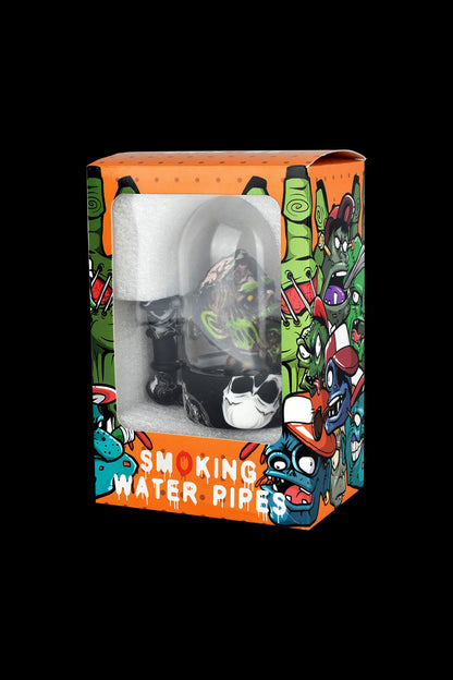 A clear plastic display case containing a glass water pipe, set against a vibrant, graffiti-style box labeled "SMOKING WATER PIPES".
