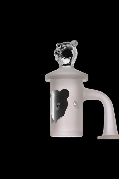 Clear glass water pipe with a sculpted bear head and intricate design, isolated on a black background.