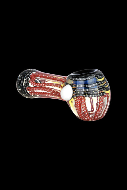 Hand pipe with red, white, and blue glass swirl design.