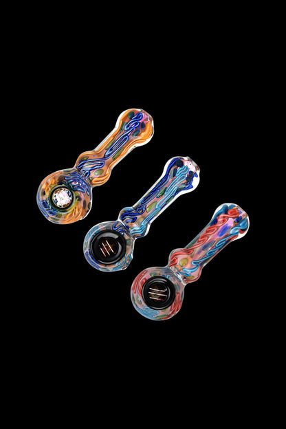Three colorful glass smoking pipes against a black background.