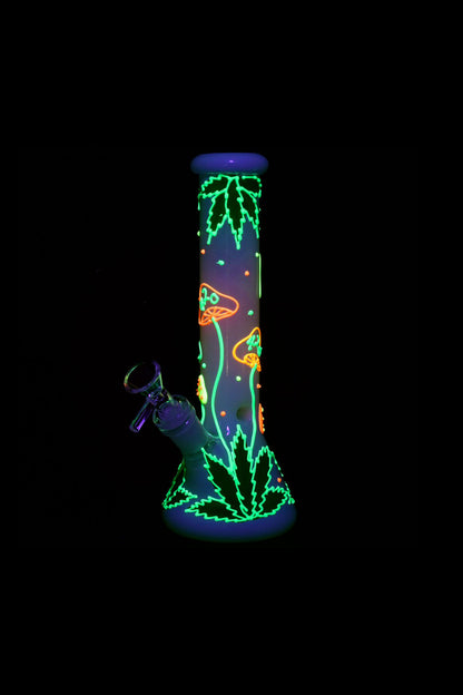 Neon green and orange cannabis leaf and mushroom designs on a glass bong, isolated on black.
