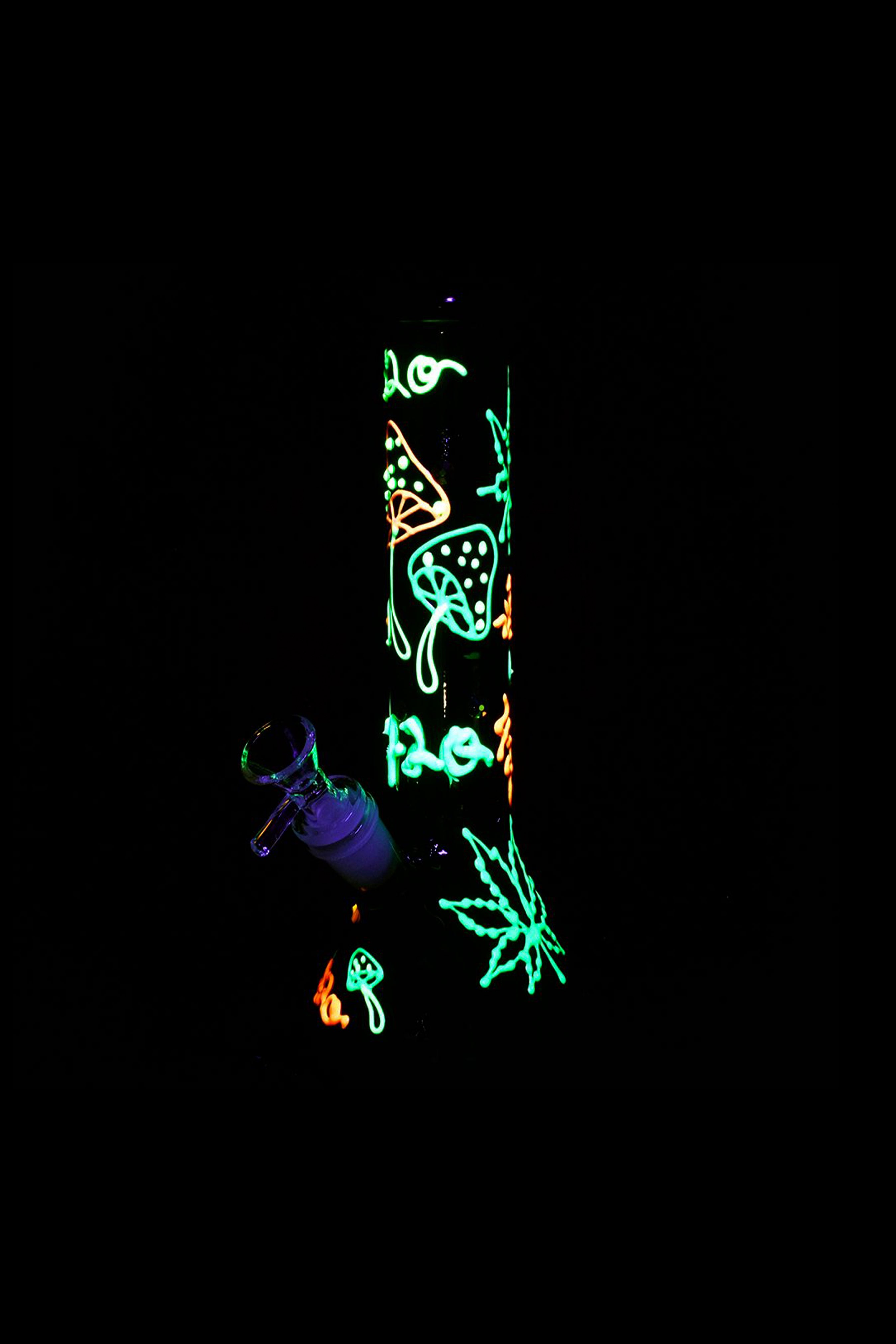 Neon cannabis and mushroom illustrations on a black glass smoking piece.