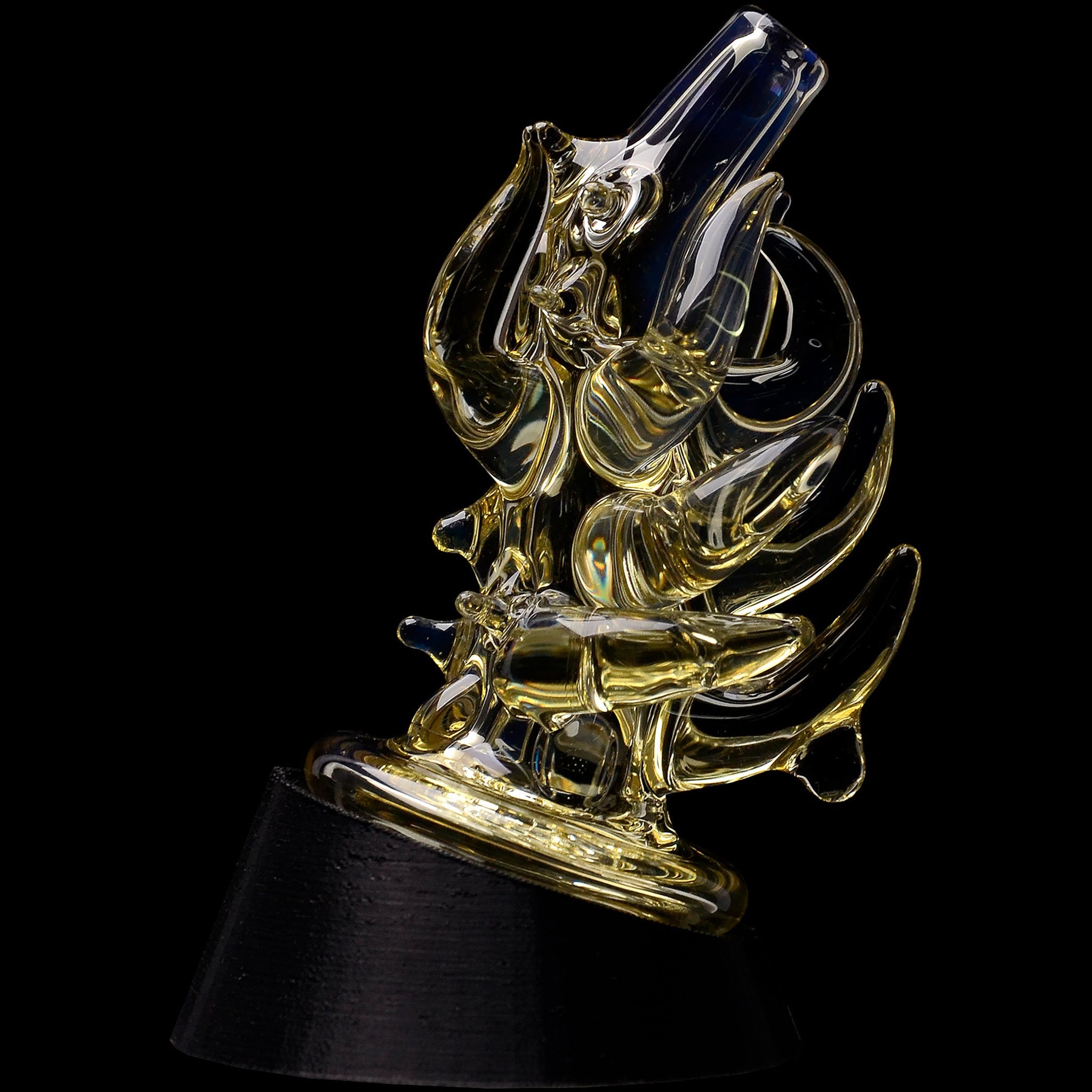 Close-up angled view of the Glassic Cosmic Tentacle Puffco Peak Glass Attachment showing glossy, golden-tinted glass tentacle forms against a black background