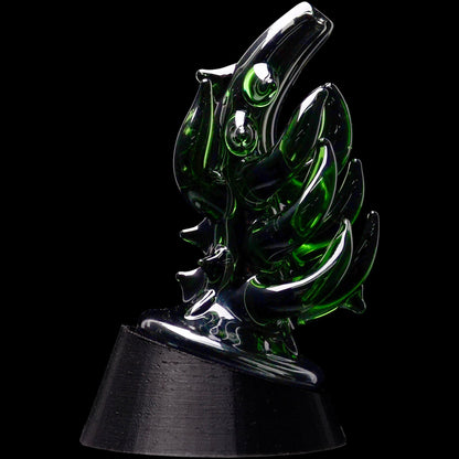 Close-up three-quarter view of the Glassic Cosmic Tentacle Puffco Peak Glass Attachment showing glossy dark green glass tentacles against a black background