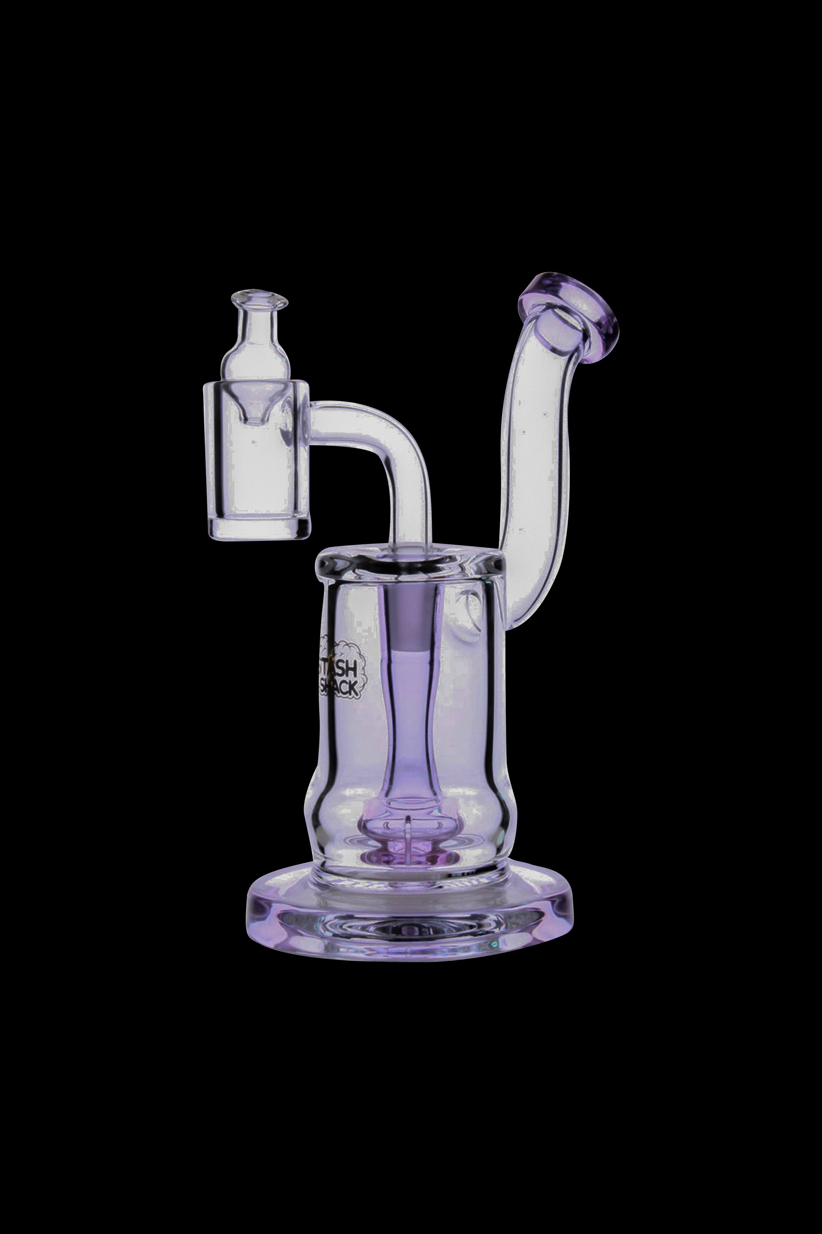 Lavender glass dab rig with quartz banger and water pipe.