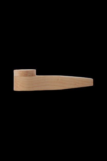 Wooden chillum pipe on a black background.
