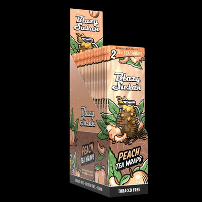 Three-quarter view of a tall display box showing multiple peach-colored Blazy Susan Peach Tea Wraps packs with illustrated peaches and a pitcher on a black background