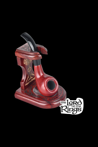 A red, ornate pipe resembling a tower from *Lord of the Rings*, positioned against a black background with the series logo.