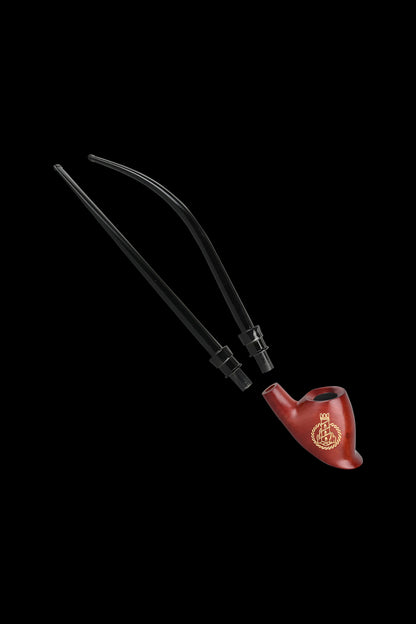 Red glass bubbler with two detachable black hoses against a black background.