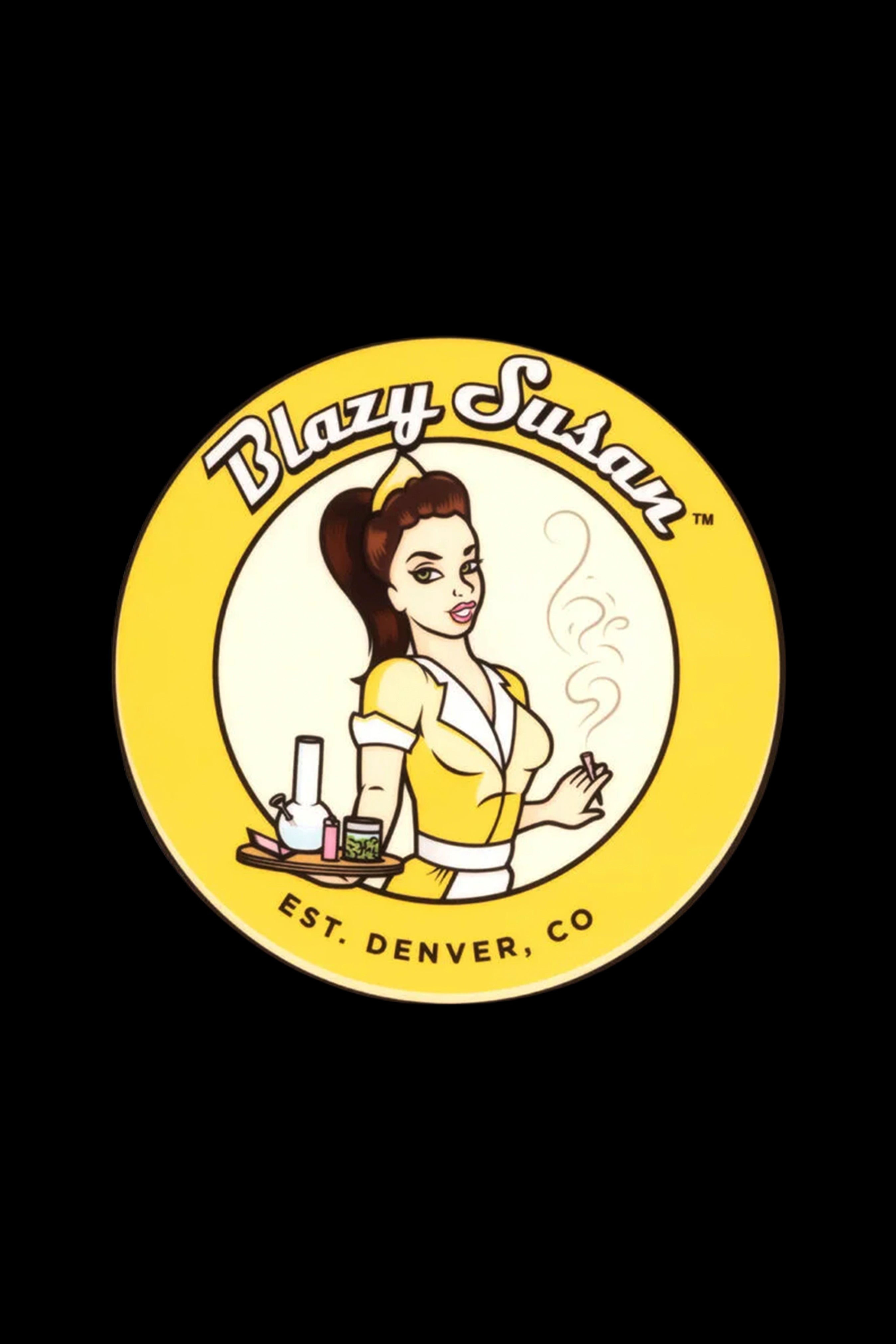 A circular logo for “Blazy Susan” featuring a vintage-style illustration of a woman holding cannabis accessories, with the text “EST. DENVER, CO” below.