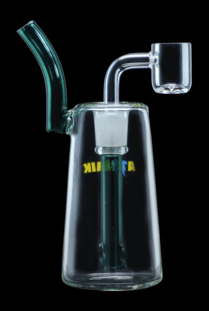 Clear glass dab rig with a bent neck and quartz banger, illuminated with green light.