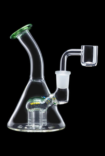 Clear glass water pipe (bong) with green accents and a quartz banger next to it, isolated on a black background.