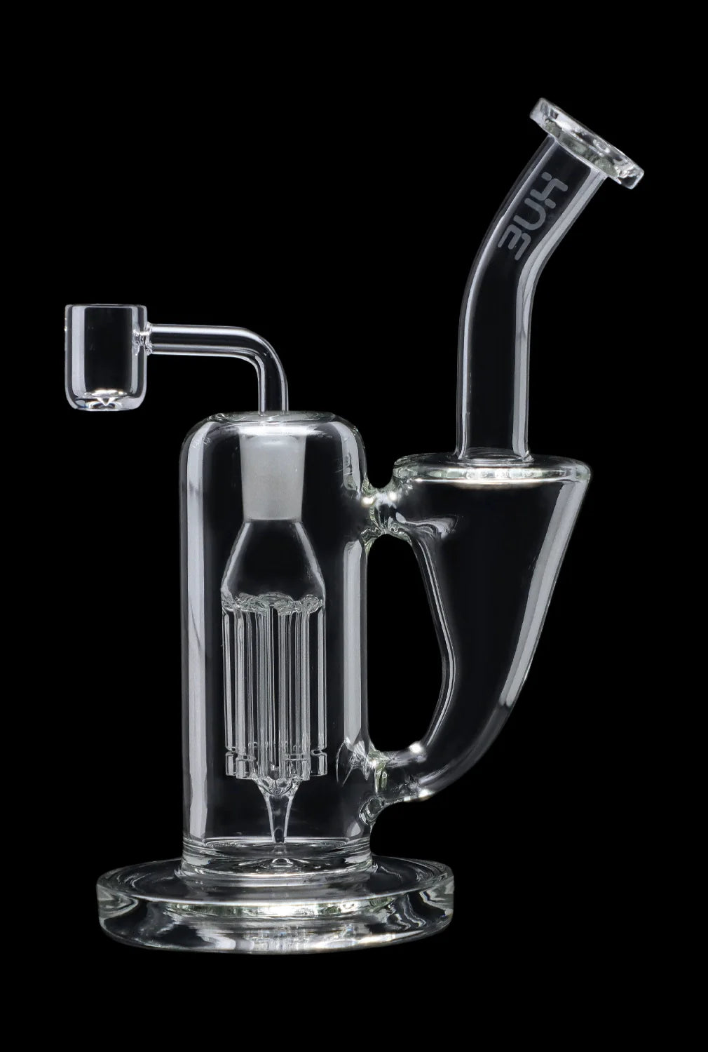 Clear glass dab rig with intricate percolator and quartz nail.