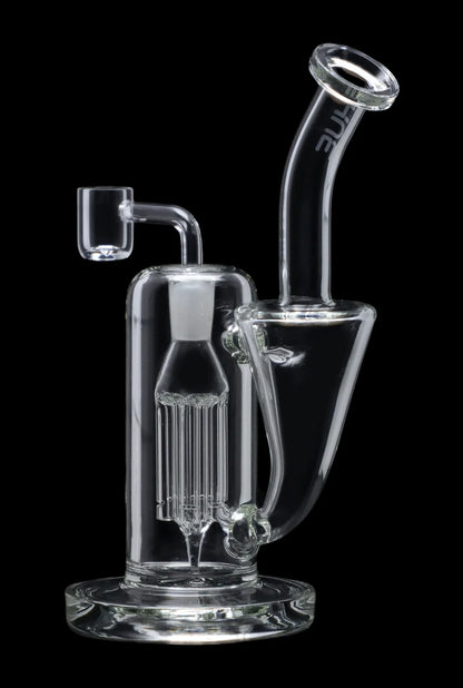 Clear glass dab rig with intricate percolator and quartz banger.