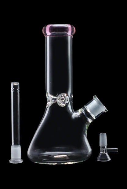 A three-quarter view of the 10-inch Smoke Cartel Beaker water pipe, featuring a colored mouthpiece and ice pinch, against a black background.