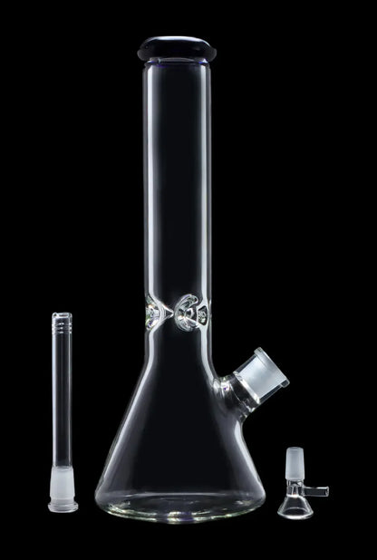 Clear glass bong with decorative silver ring and accompanying glass downstem and bowl, isolated on black.