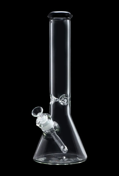 Clear glass bong with a downstem and bowl, isolated on a black background.