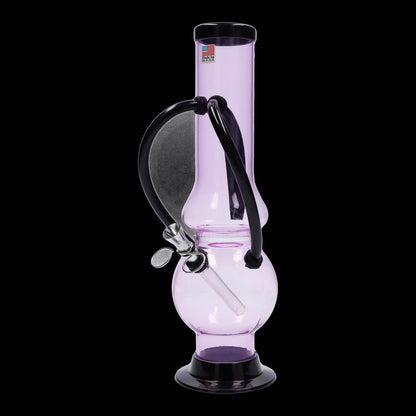 Pink glass water pipe with black accents, studio shot on a black background.