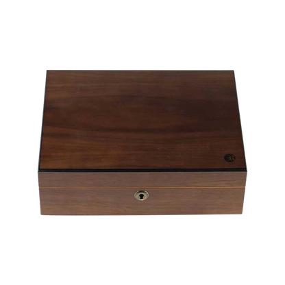 Top-down view of the RYOT Humidor Walnut Combo Box (8X11) showing a closed walnut lid with subtle wood grain, black trim and a front keyhole.