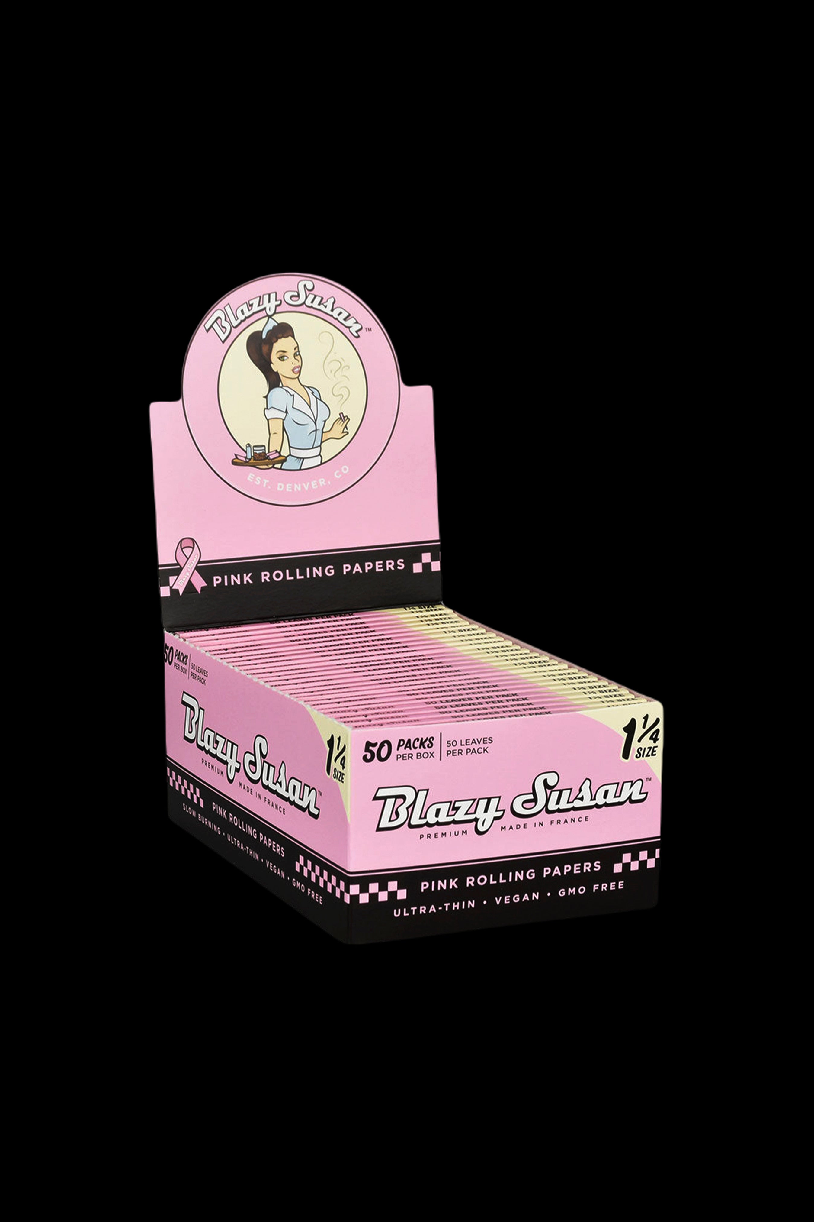 Pink box of Blazy Susan rolling papers with vintage pin-up design. <start_of_image>