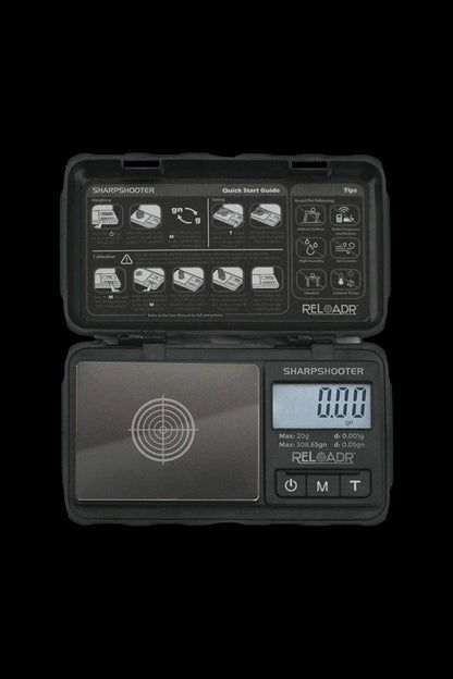 Digital scale displaying “0.000” with a black and grey design, open on a dark surface.